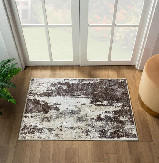 Abstract brown patterned rug on a wooden floor with a large window in the background