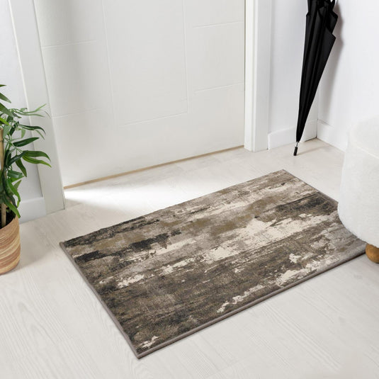 abstract beige doormat on a white floor in front of door