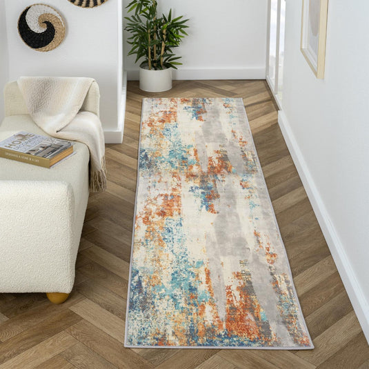 Colorful runner rug on a wooden floor in a living room setting.